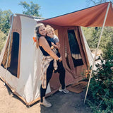 enjoying family camping trip with cabin tent 